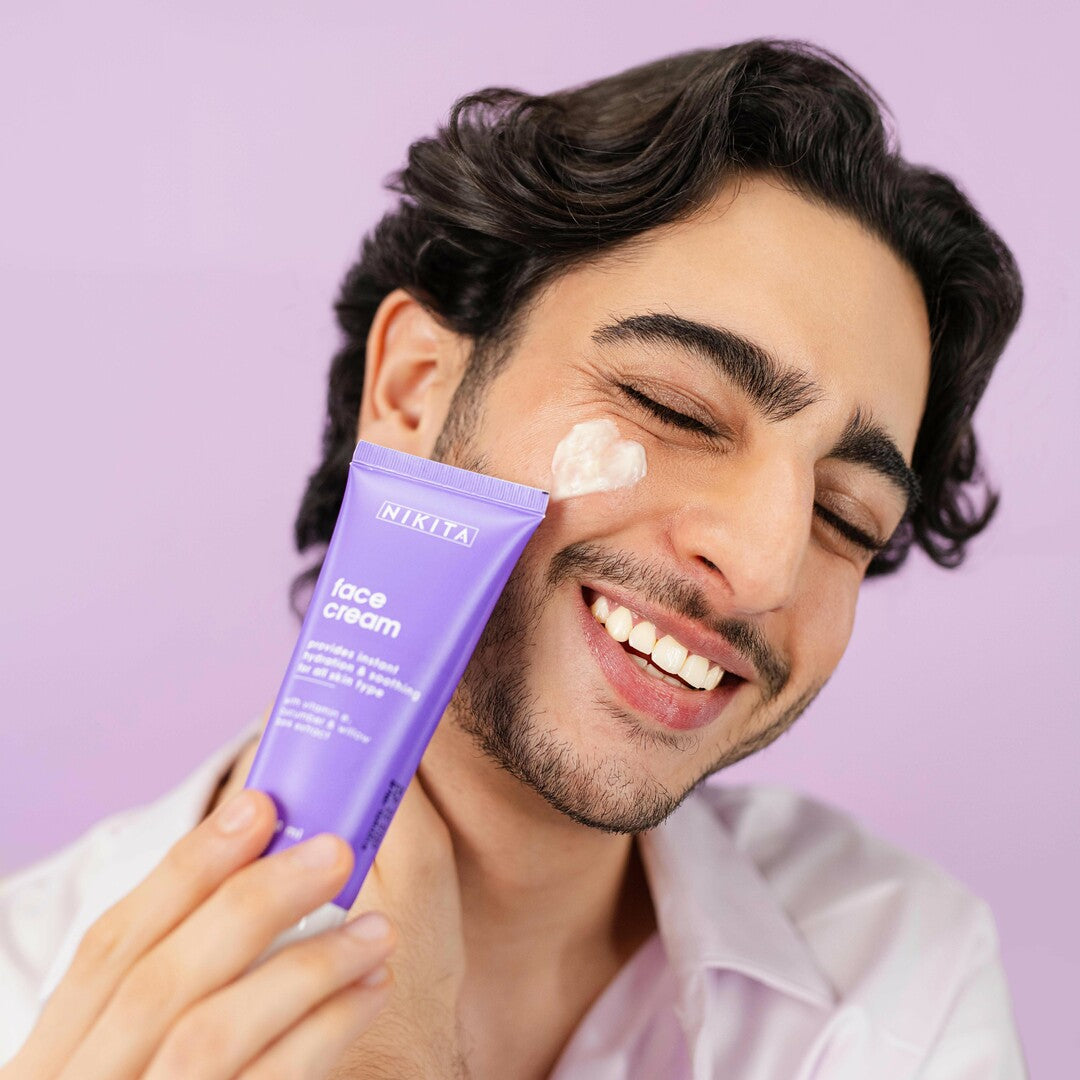 Man using face moisturizer for oily skin